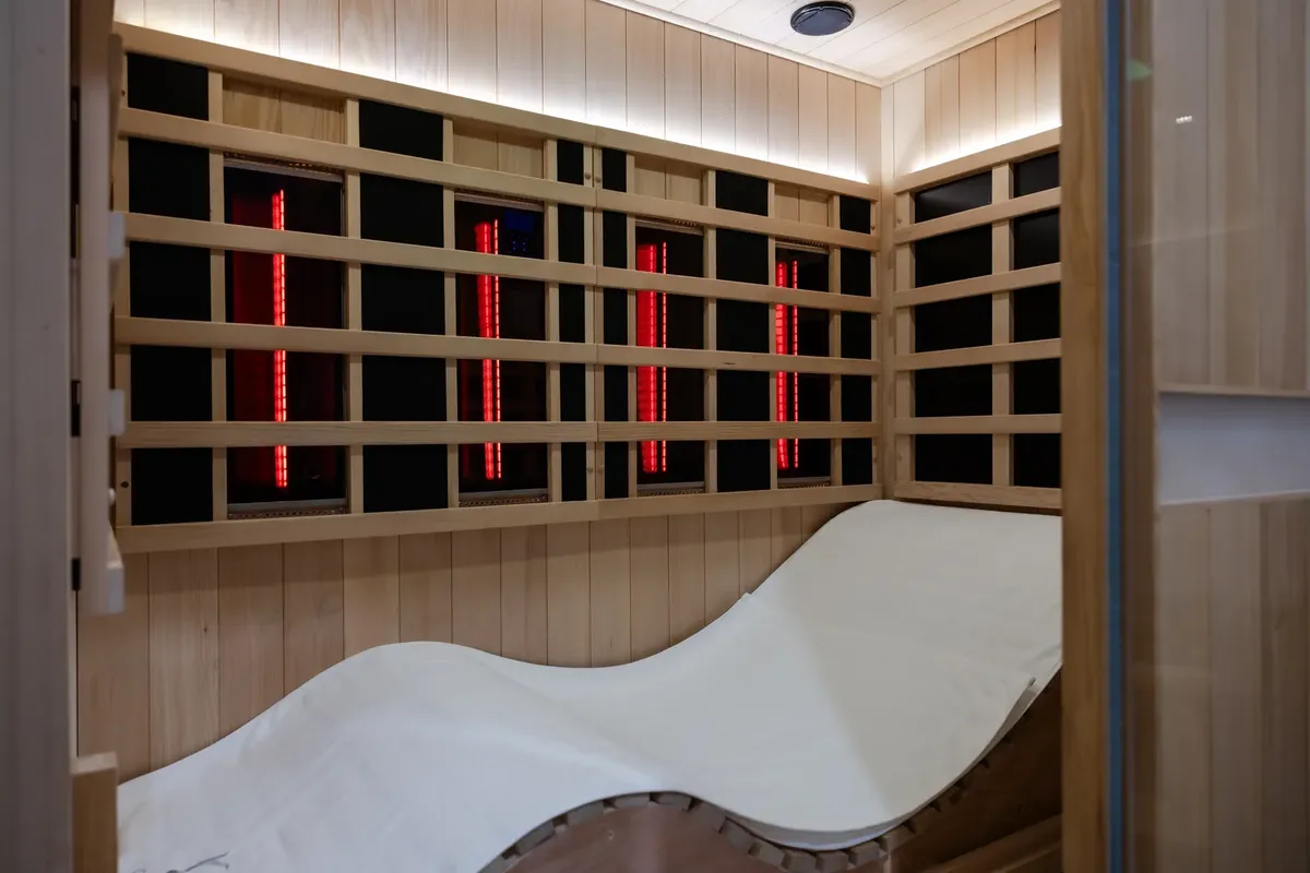 Full-spectrum infrared cabin with lie-flat lounger at O2 Light Bar